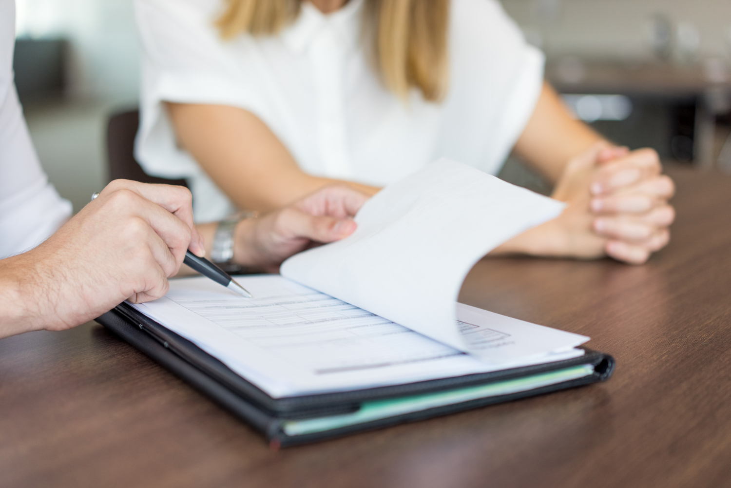 hands-male-executive-showing-contract-female-partner-meeting.jpg